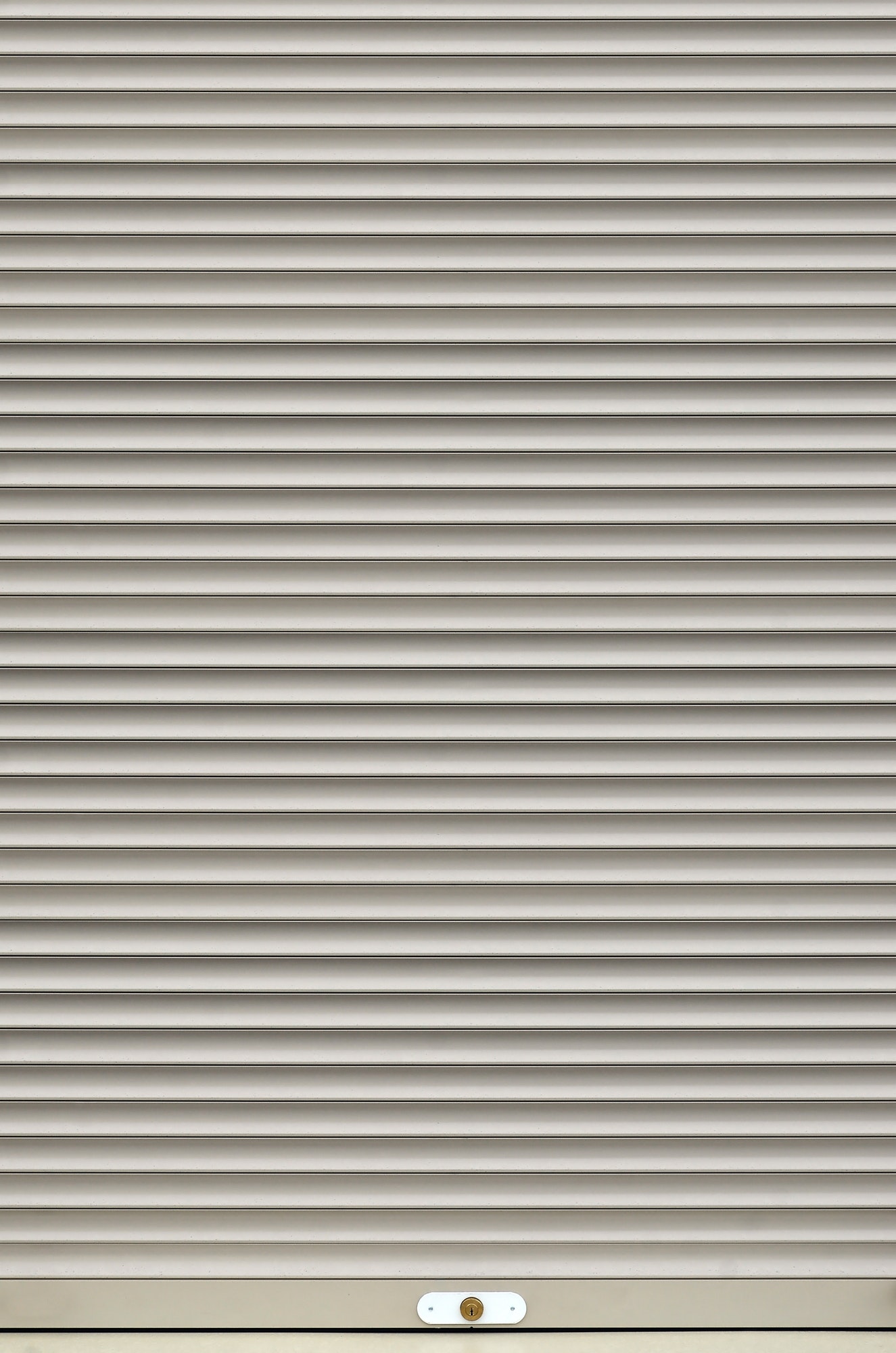 The texture of corrugated metal sheet, white or grey slide door